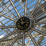 Clock in Stephans Green Shopping Centre in Dublin. Made in Cork The clock can be found close to the ceiling of the shopping mall. A central place for people to look up and get aquainted with the current time. The steel construction is typical of the structure of the whole shopping mall which is build in steel with brick walls.
