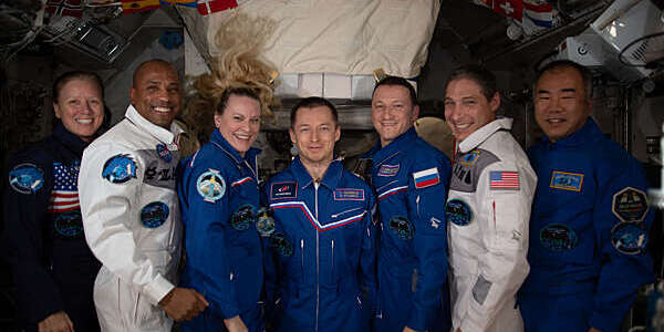 Line-up of the Expedition 64 crew. From left: NASA astronauts Shannon Walker, Victor Glover and Kate Rubins; Roscosmos cosmonauts Sergey Ryzhikov and Sergey Kud-Sverchkov; NASA astronaut Michael Hopkins; and JAXA astronaut Soichi Noguchi. 